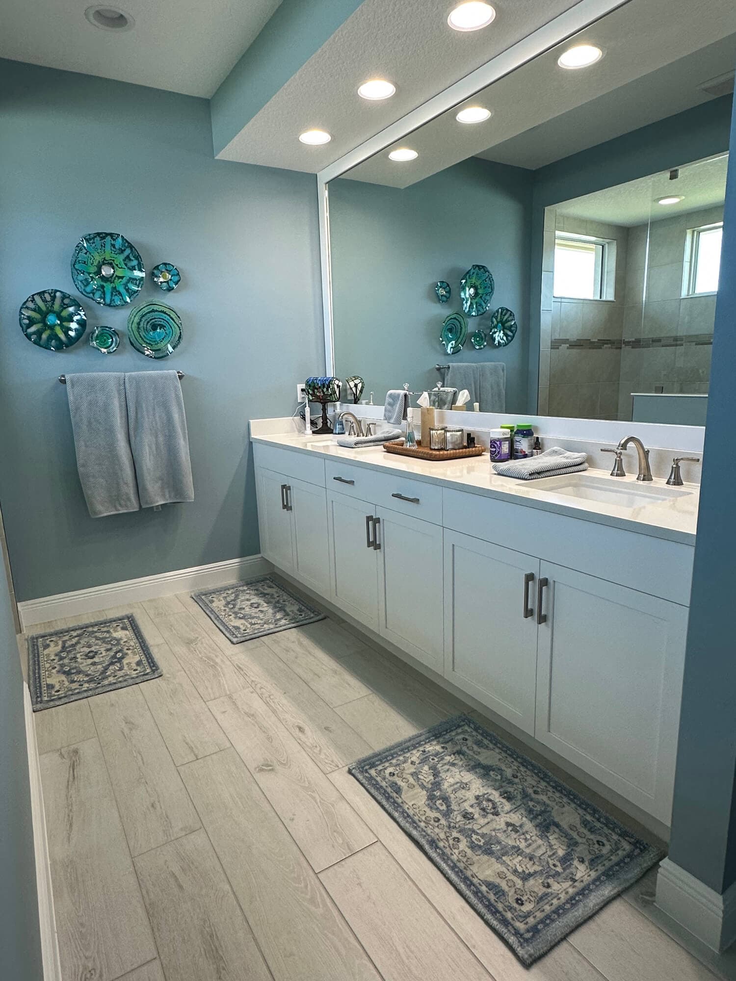 Immaculate modern bathroom with polished vanity and mirrors